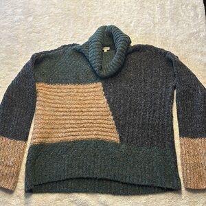 Small, oversized, turtleneck cable knit sweater